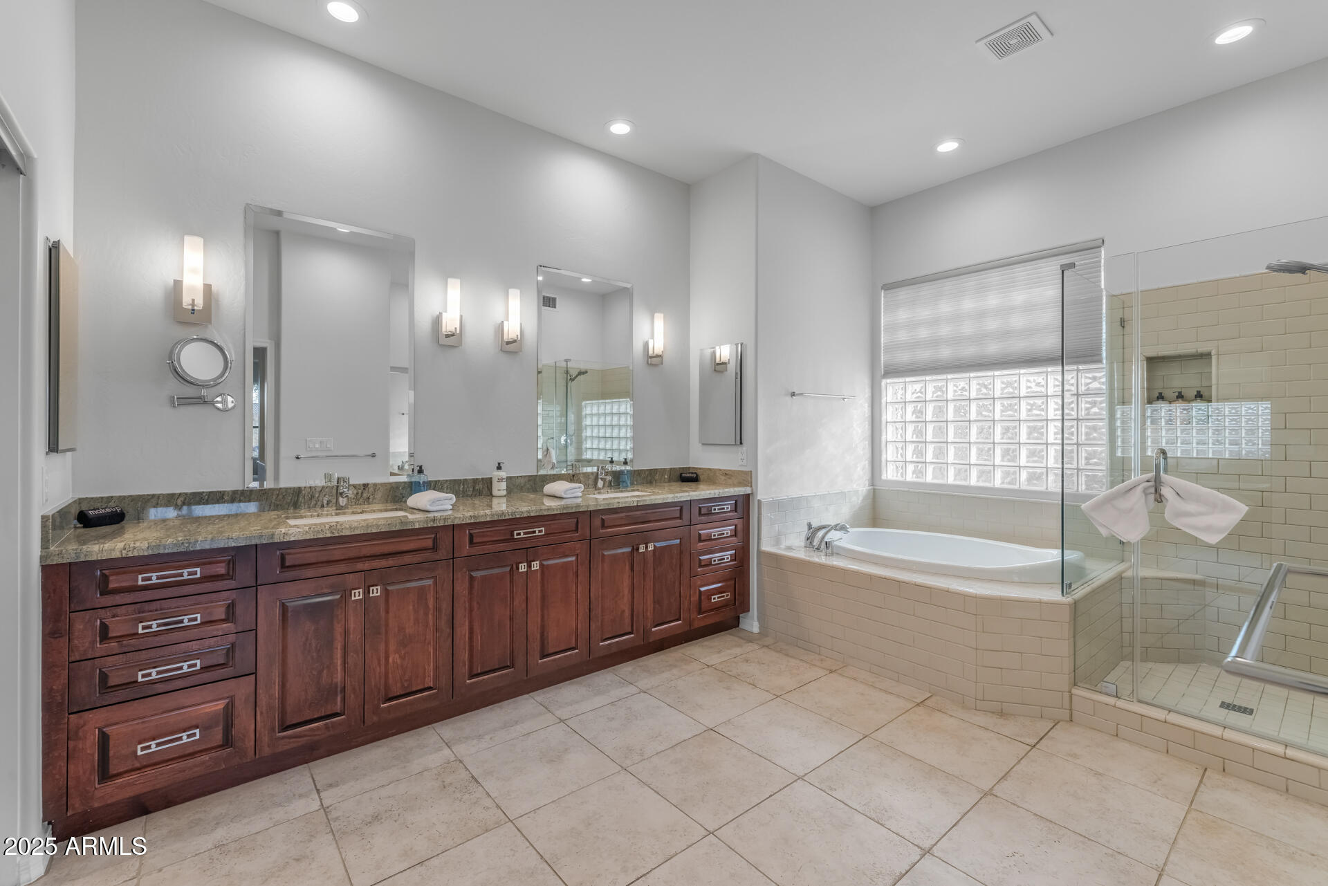 7474 East Red Bird Road Scottsdale, AZ 85266 - Photo 23 of 40 a large spacious bathroom with a granite countertop tub a double vanity sink and a large mirror