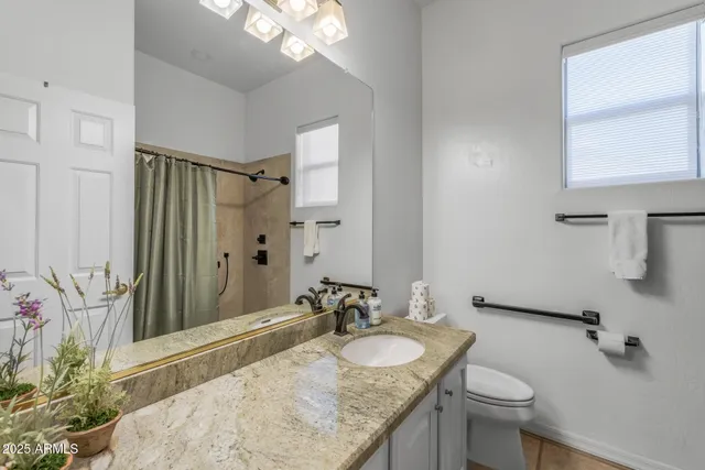 a view of a room with a table and chairs