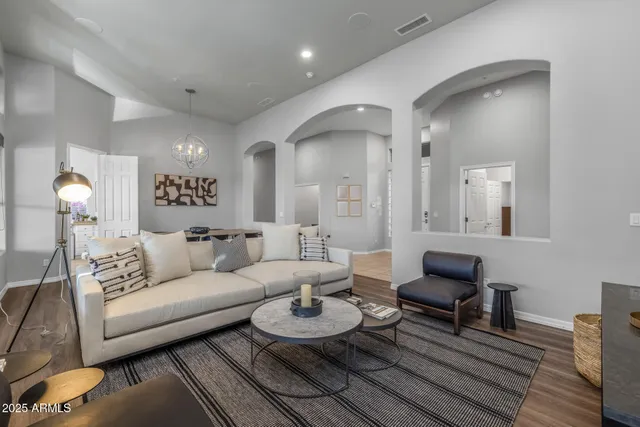 a living room with furniture and a large window