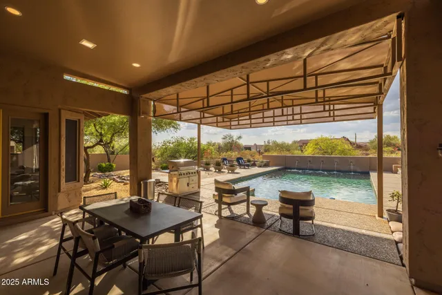 a view of a patio with couches table and chairs