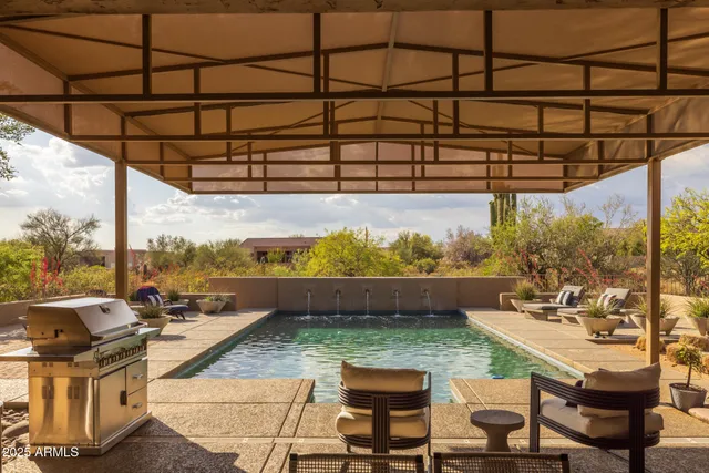 a view of a swimming pool with a patio