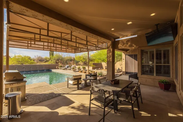 a view of a swimming pool with a patio