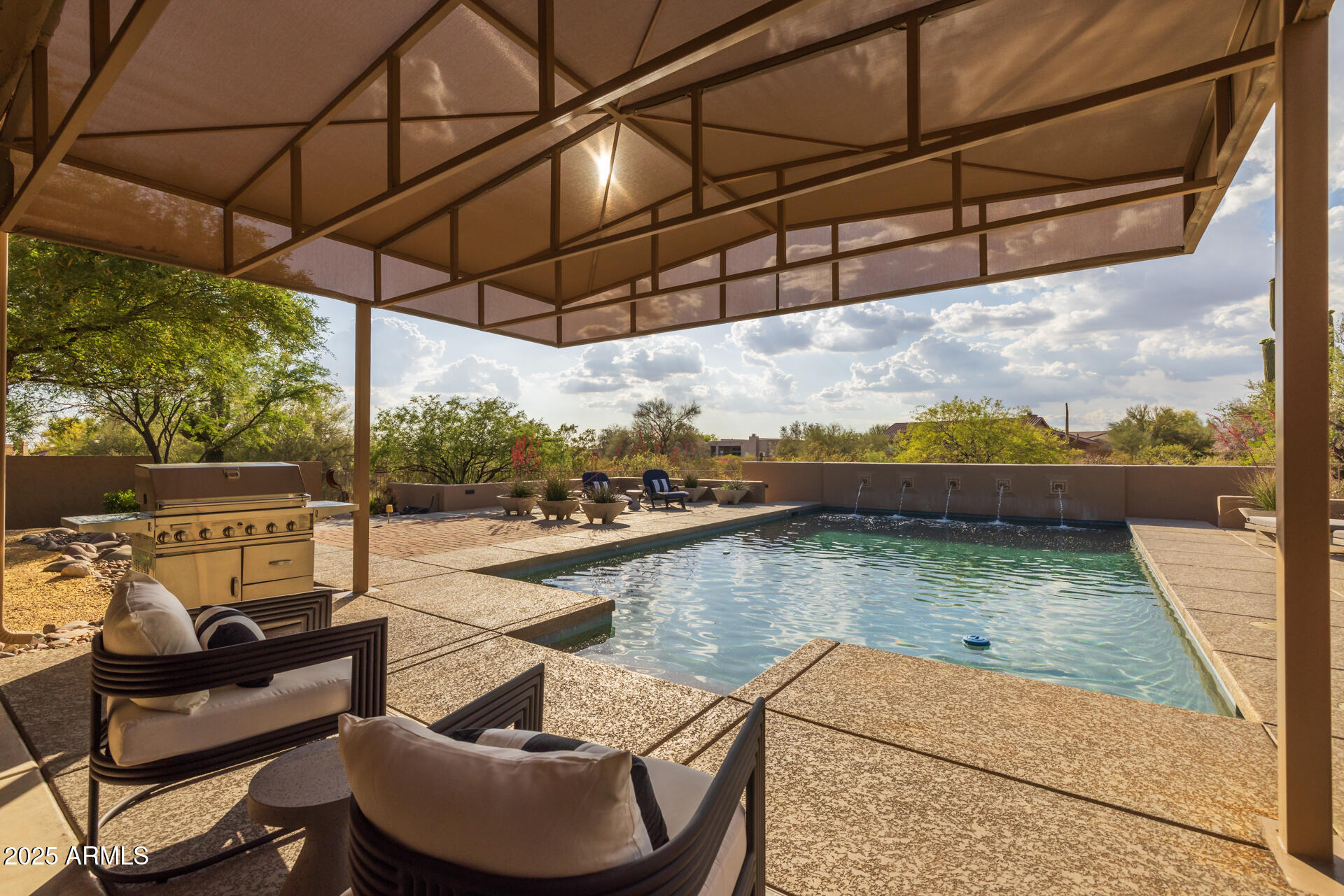 7474 East Red Bird Road Scottsdale, AZ 85266 - Photo 37 of 40 a view of a swimming pool with a patio