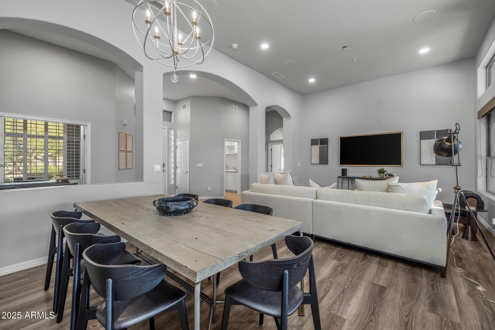 7474 East Red Bird Road Scottsdale, AZ 85266 - Photo 5 of 40 a view of a dining room with furniture and wooden floor