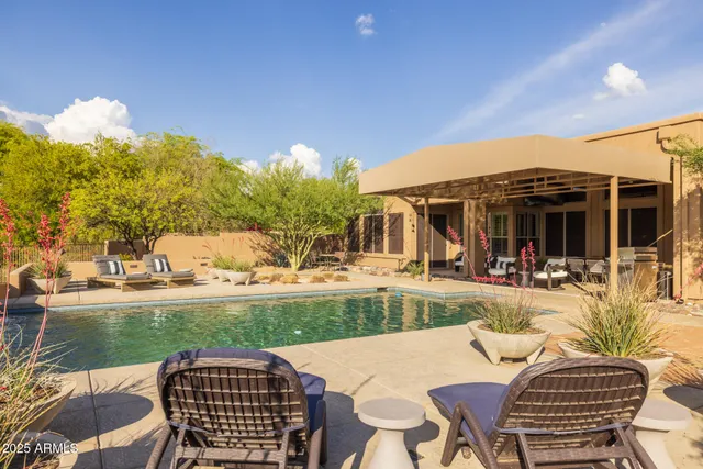 a view of a swimming pool with a patio