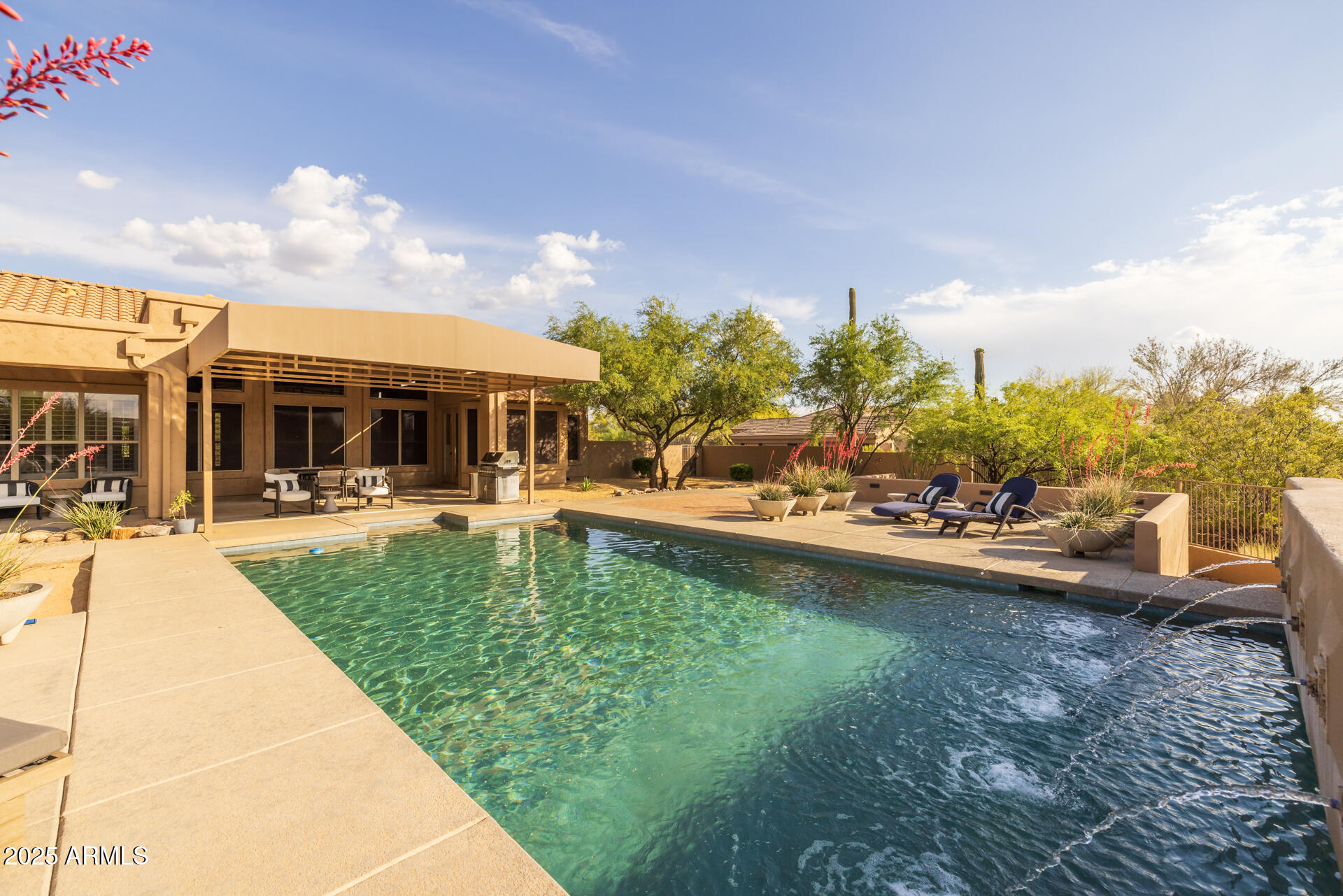 7474 East Red Bird Road Scottsdale, AZ 85266 - Photo 9 of 40 a view of a swimming pool with a patio