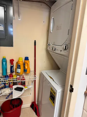 a bedroom with two beds and painting on the wall