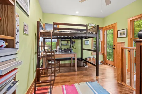 a dining room with furniture and wooden floor