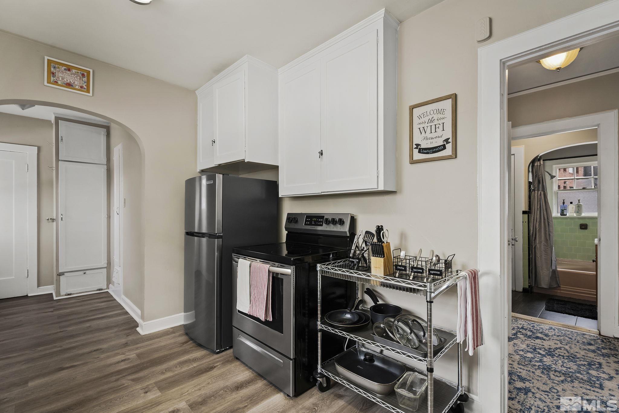 354 West Liberty Street Reno, NV 89501 - Photo 7 of 16 a kitchen with stainless steel appliances granite countertop a refrigerator stove and sink