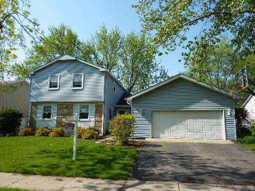 62 Timber Hill Road Buffalo Grove, IL 60089 - Photo 1 of 1 a front view of house with yard and green space