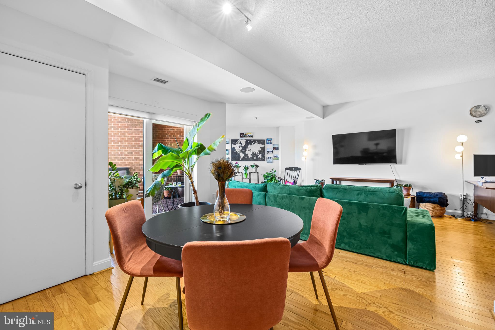 2515 Boston Street, Unit 1206 Baltimore, MD 21224 - Photo 12 of 29 a dining room with furniture and a floor to ceiling window