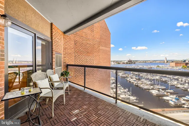 a view of a balcony with chairs