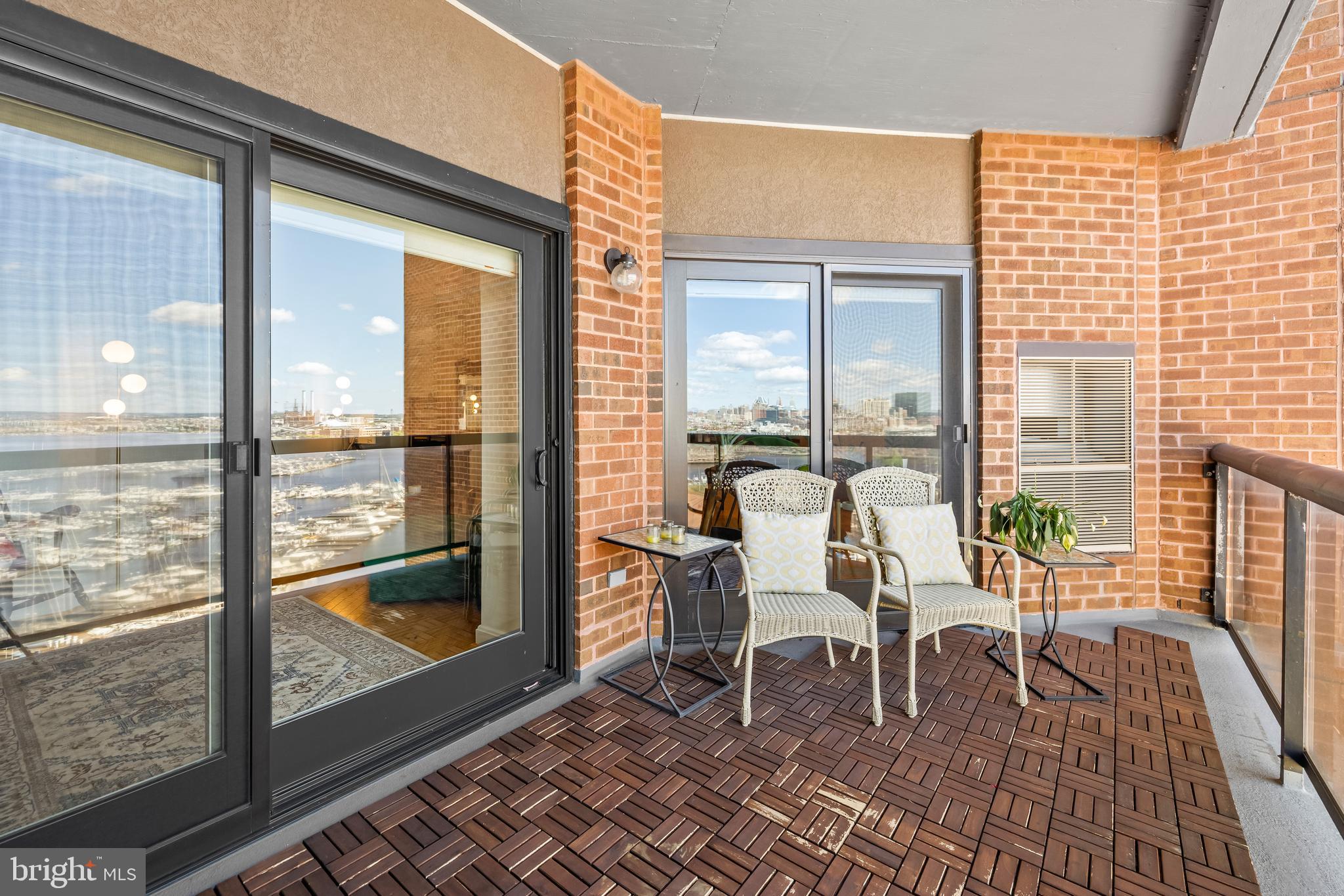 2515 Boston Street, Unit 1206 Baltimore, MD 21224 - Photo 17 of 29 a dining room with furniture and wooden floor