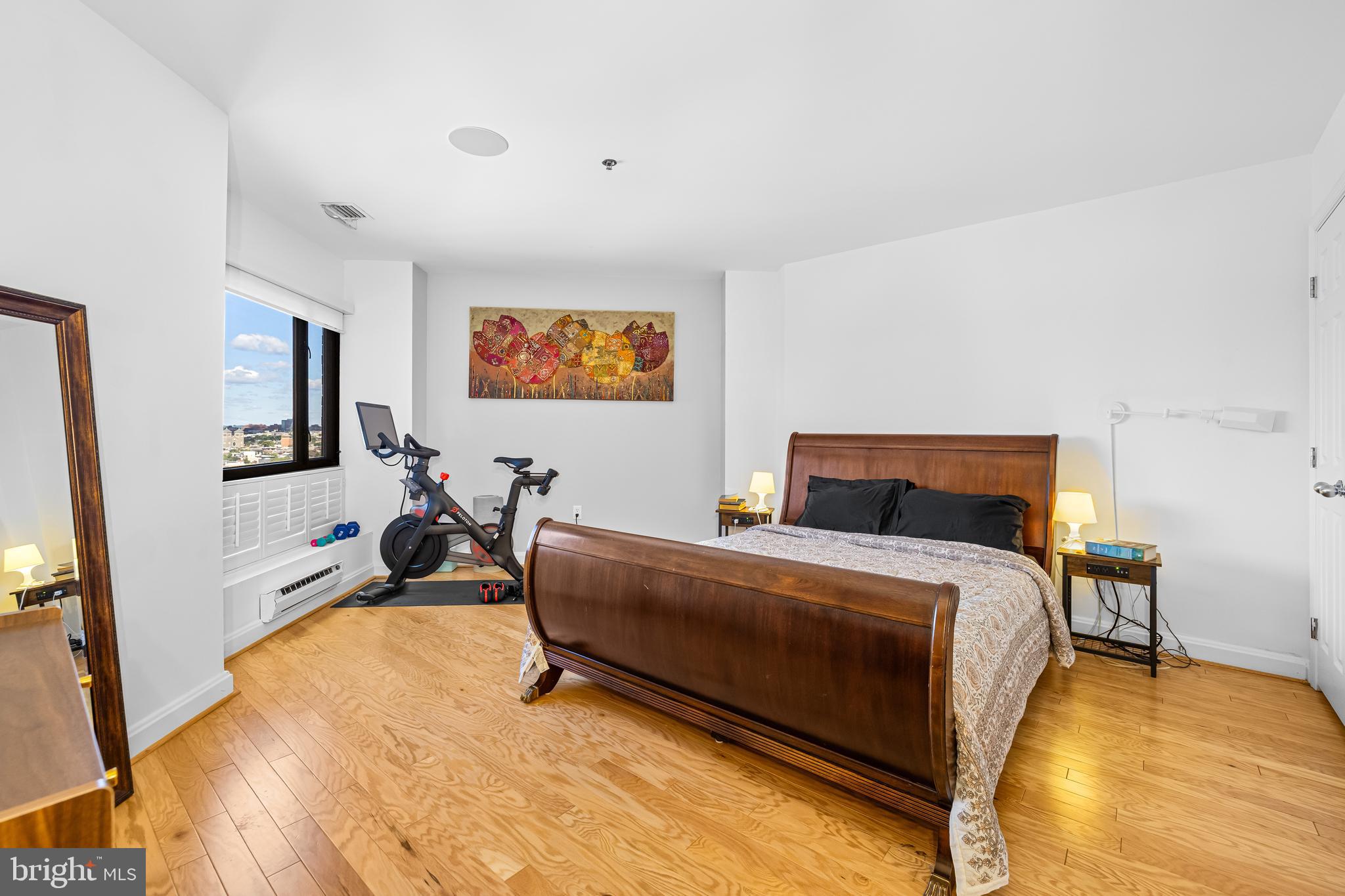 2515 Boston Street, Unit 1206 Baltimore, MD 21224 - Photo 19 of 29 a bed room with a bed and a tv