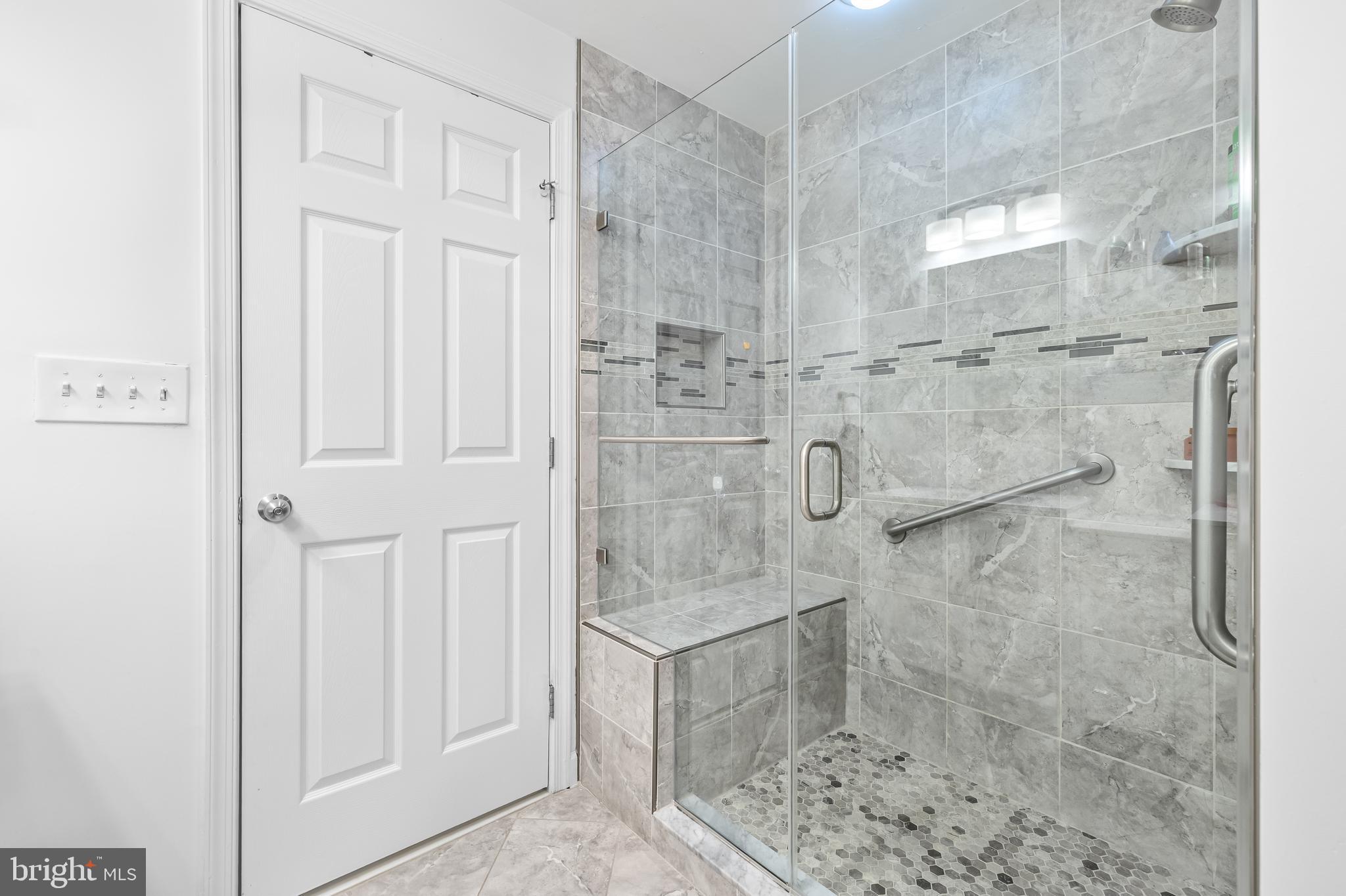 2515 Boston Street, Unit 1206 Baltimore, MD 21224 - Photo 21 of 29 a bathroom with a shower