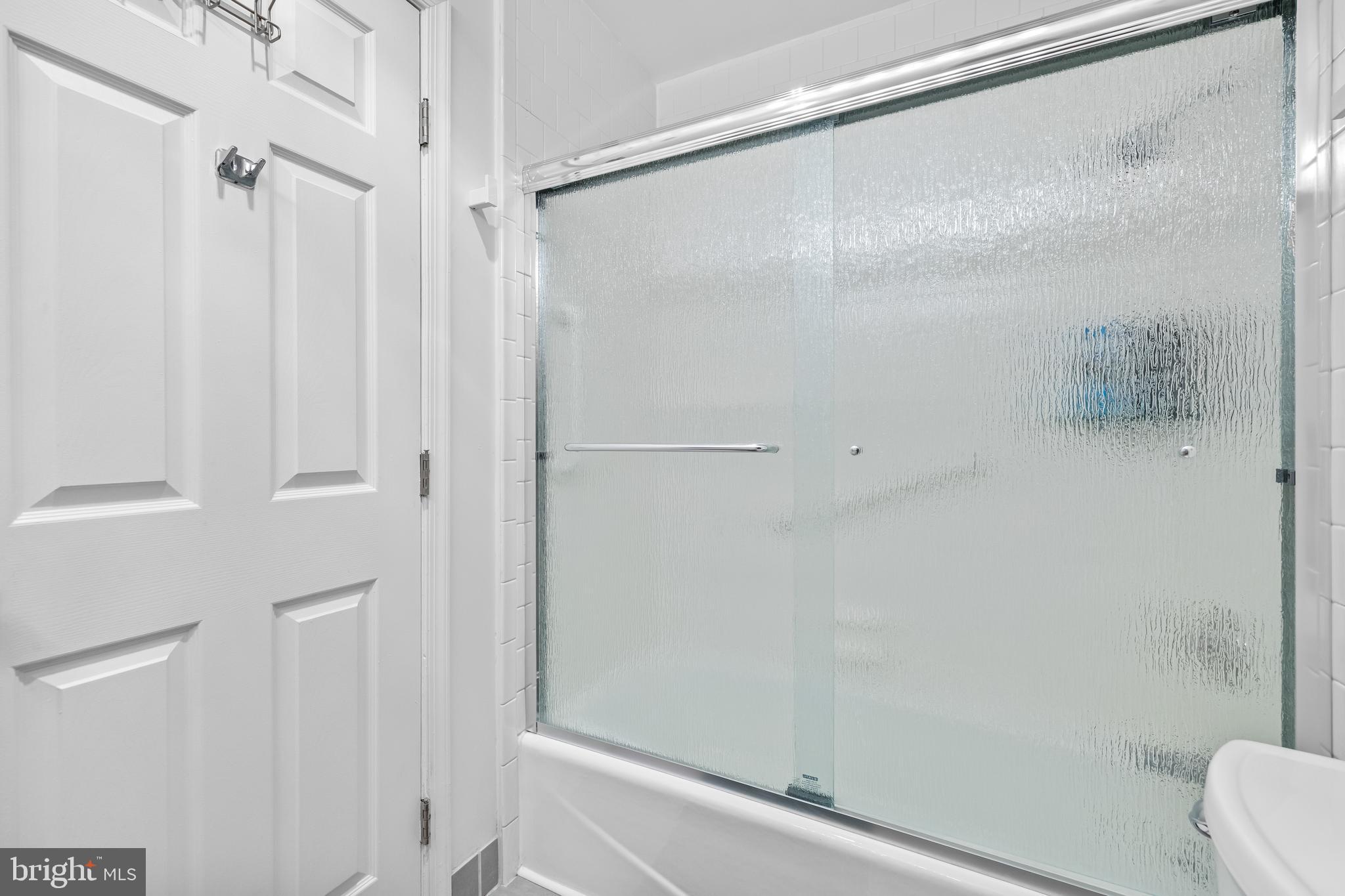 2515 Boston Street, Unit 1206 Baltimore, MD 21224 - Photo 25 of 29 a bathroom with a shower