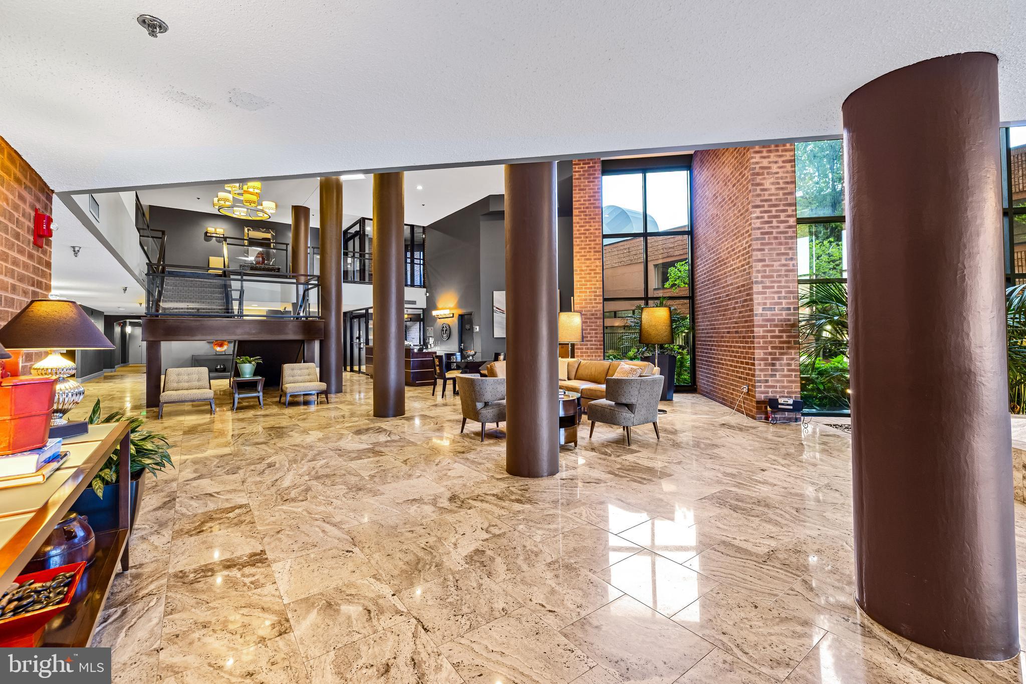 2515 Boston Street, Unit 1206 Baltimore, MD 21224 - Photo 28 of 29 a view of living room with furniture and large windows