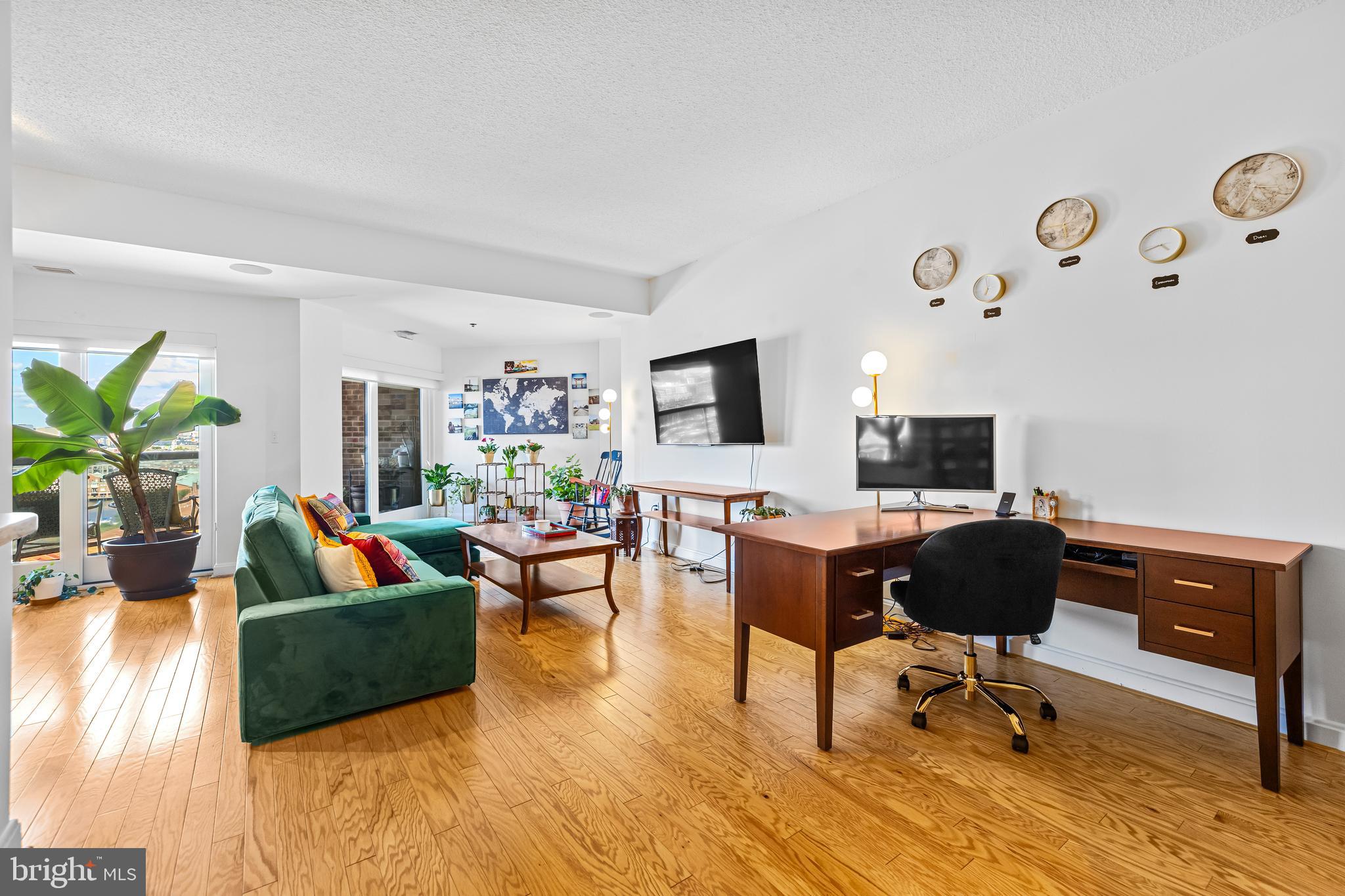 2515 Boston Street, Unit 1206 Baltimore, MD 21224 - Photo 5 of 29 a view of a livingroom with workspace and a couch