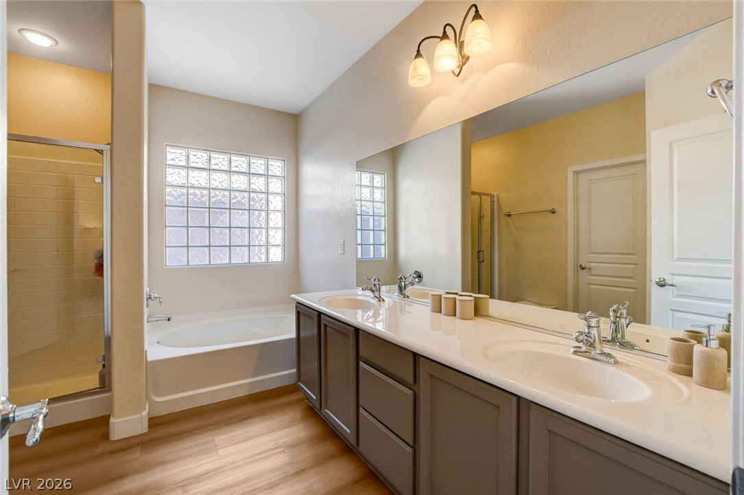 2649 Rue Marquette Avenue Henderson, NV 89044 - Photo 45 of 55 This serene bathroom offers a spacious double vanity, a soaking tub, and a separate shower.