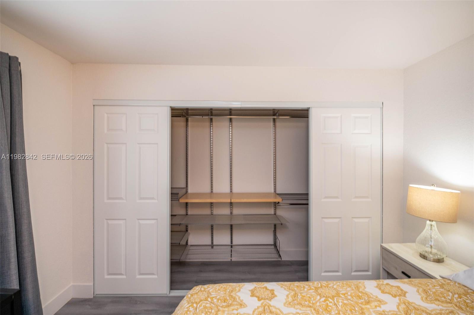 4702 Southwest 67th Avenue, Unit O7 Miami, FL 33155 - Photo 15 of 32 a bedroom with a bed and a view of bathroom