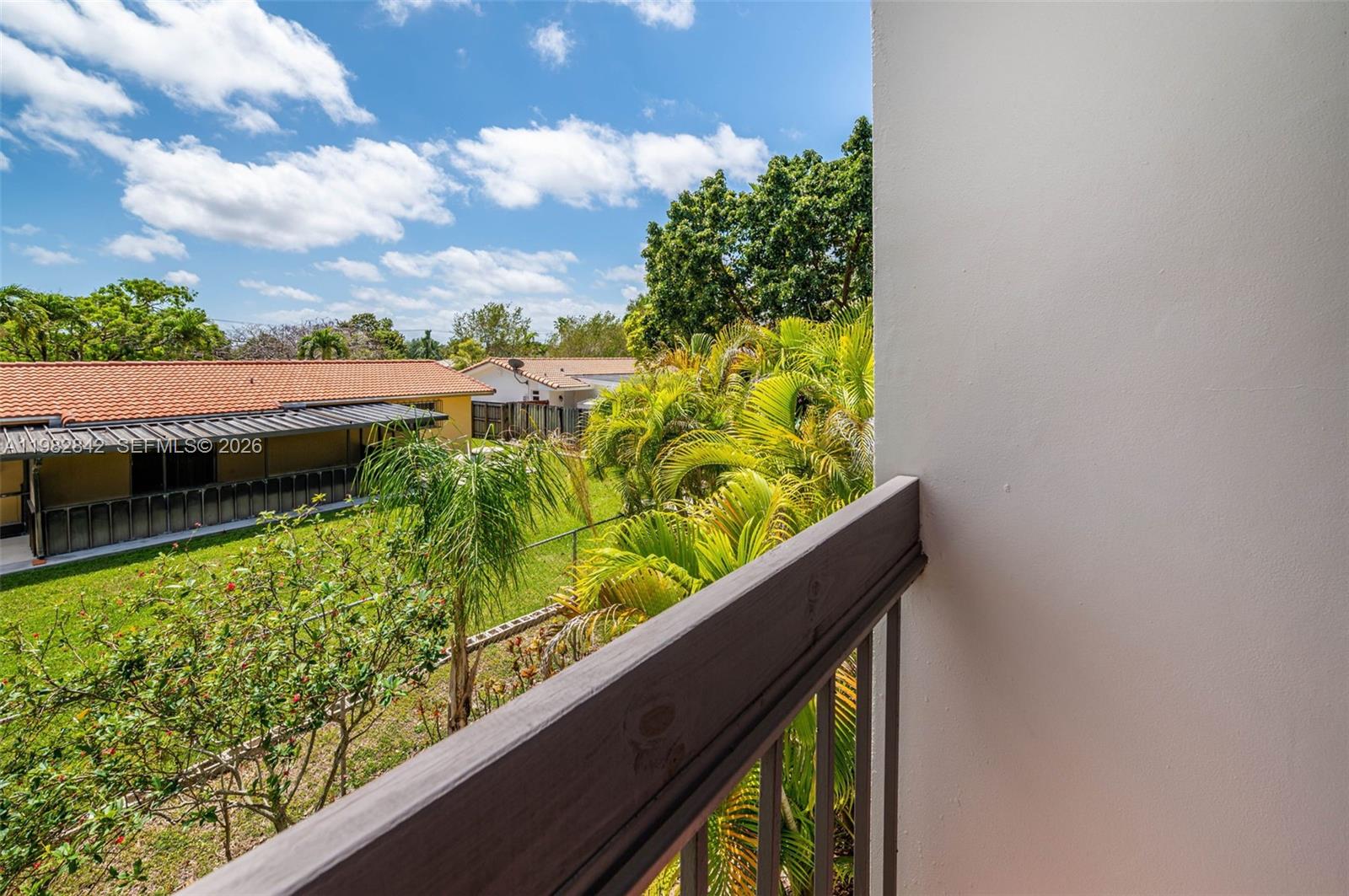 4702 Southwest 67th Avenue, Unit O7 Miami, FL 33155 - Photo 17 of 32 a view of a garden from a balcony