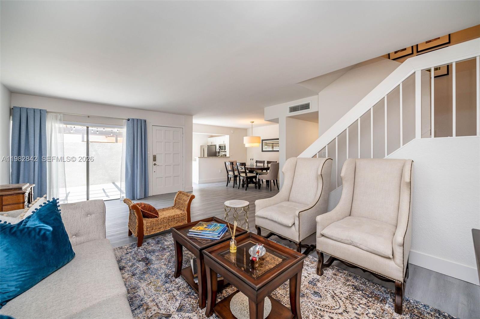 4702 Southwest 67th Avenue, Unit O7 Miami, FL 33155 - Photo 2 of 32 a living room with furniture and wooden floor