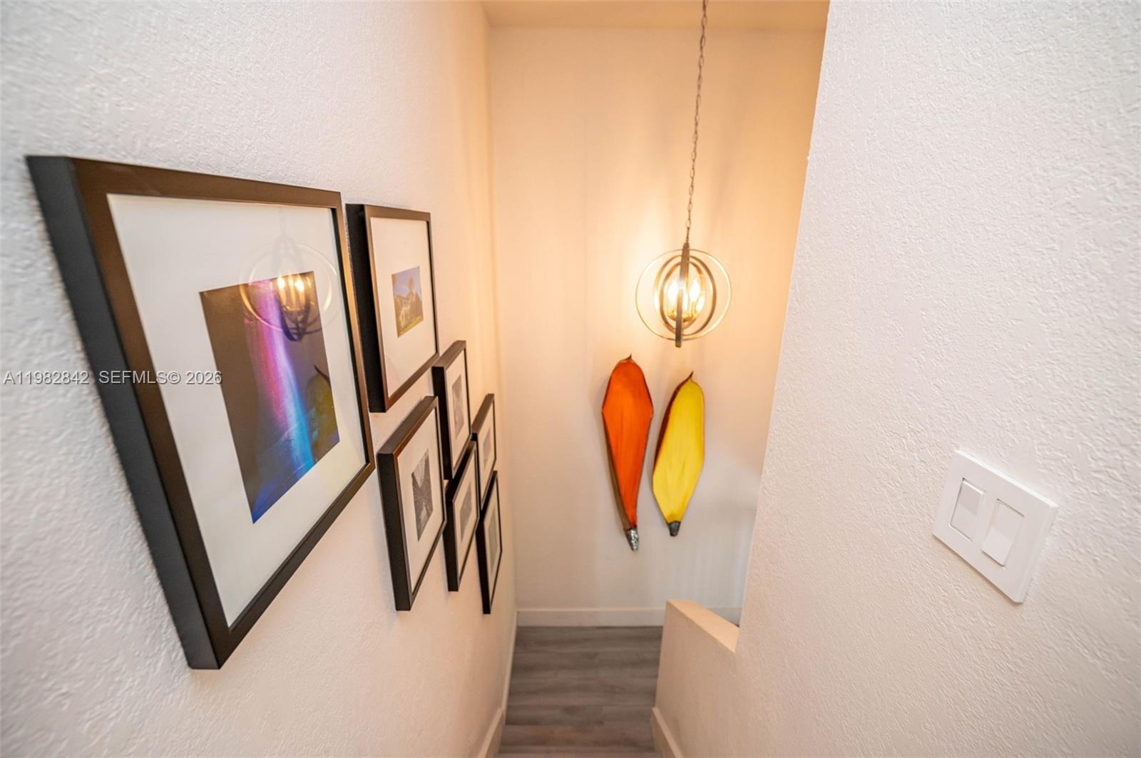 4702 Southwest 67th Avenue, Unit O7 Miami, FL 33155 - Photo 25 of 32 a view of front door with wooden floor