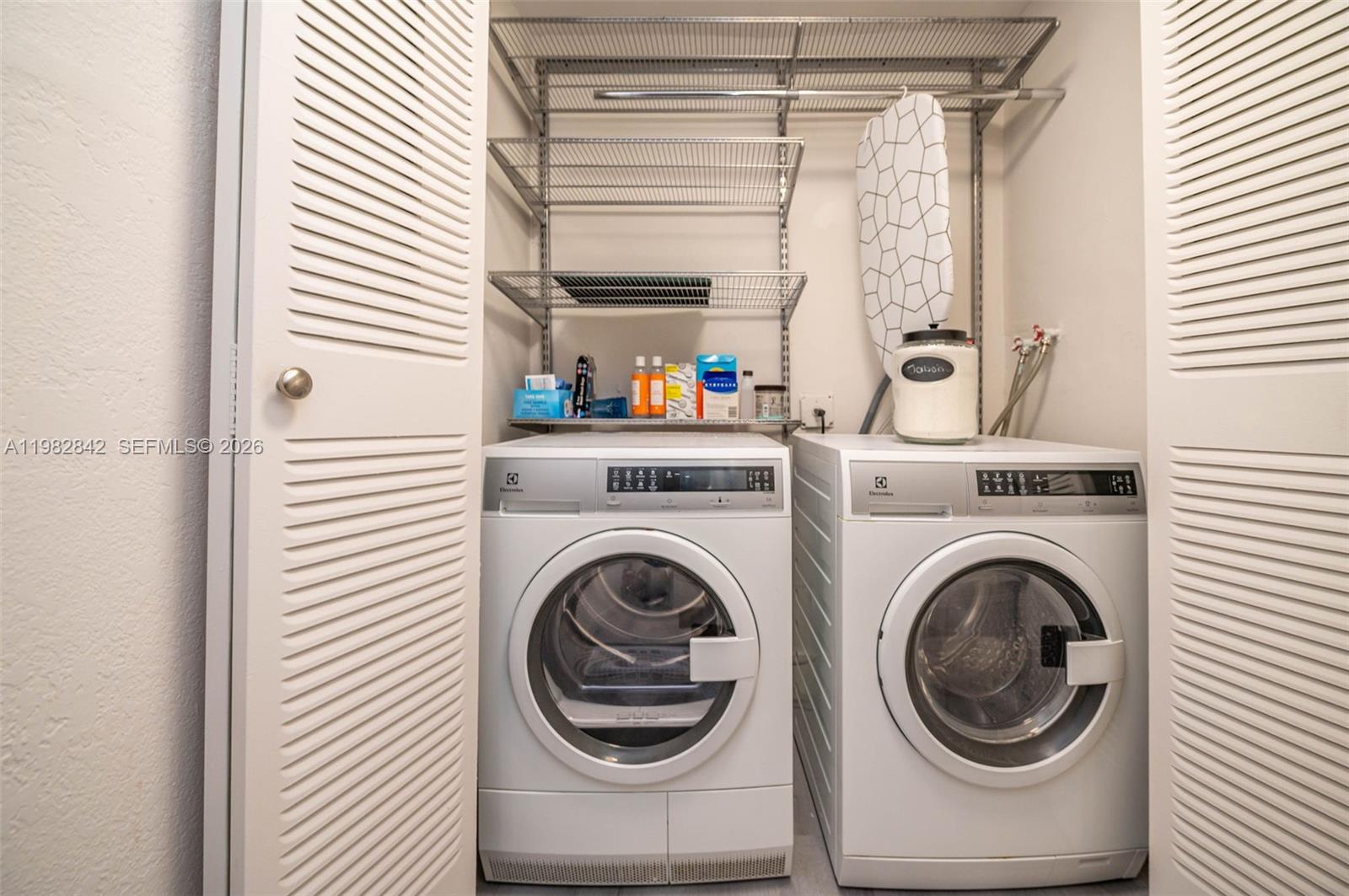 4702 Southwest 67th Avenue, Unit O7 Miami, FL 33155 - Photo 26 of 32 a utility room with dryer and washer