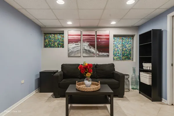 a living room with furniture and a large window