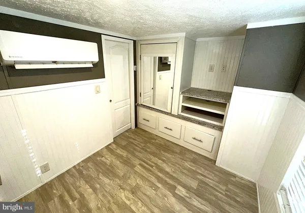 a view of kitchen with wooden floor