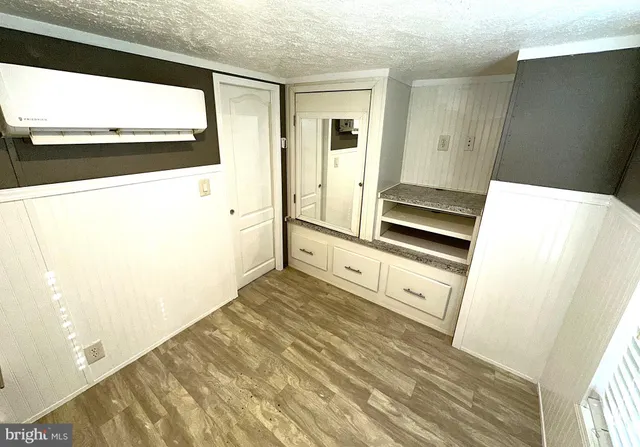 a view of kitchen with wooden floor