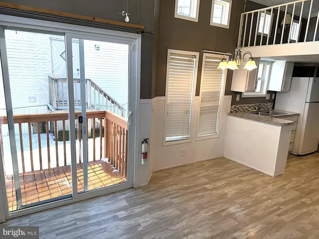 a view of washer and dryer with wooden floor
