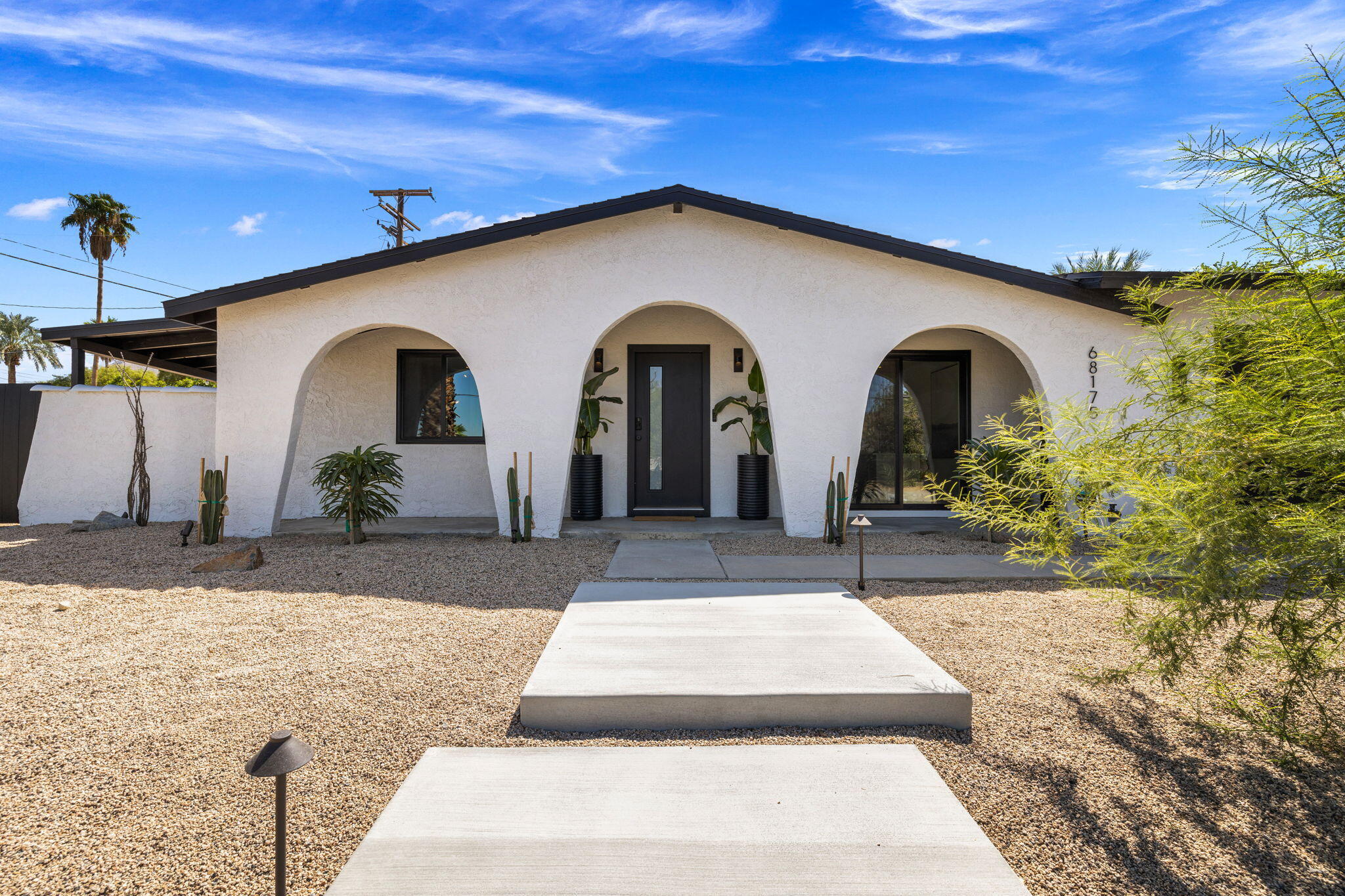 68175 Terrace Road Cathedral City, CA 92234 - Photo 1 of 53 a front view of a house with garden