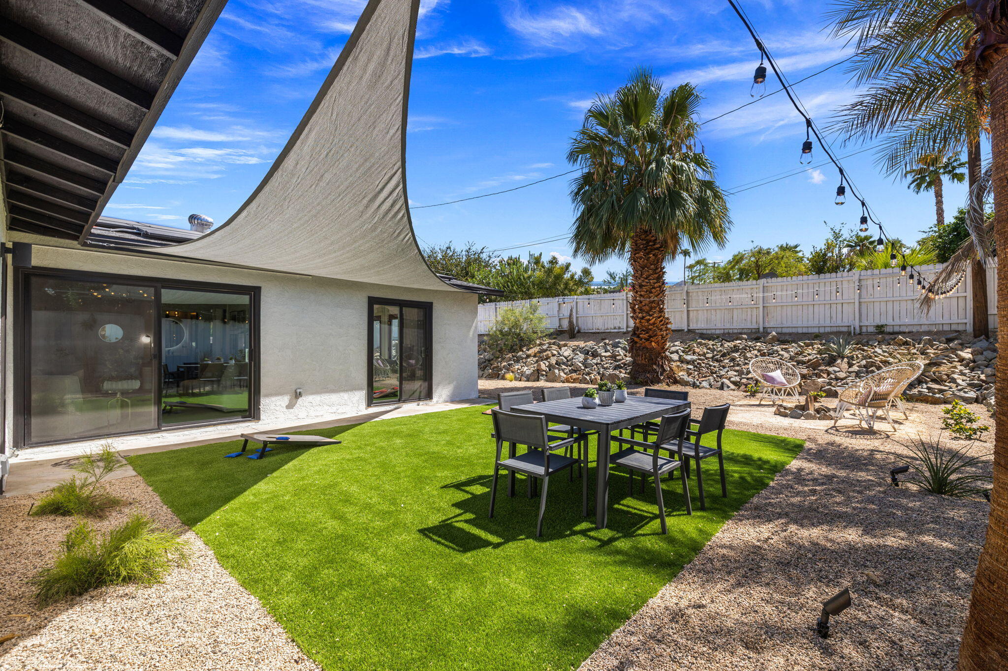 68175 Terrace Road Cathedral City, CA 92234 - Photo 11 of 53 a view of a house with backyard sitting area and garden