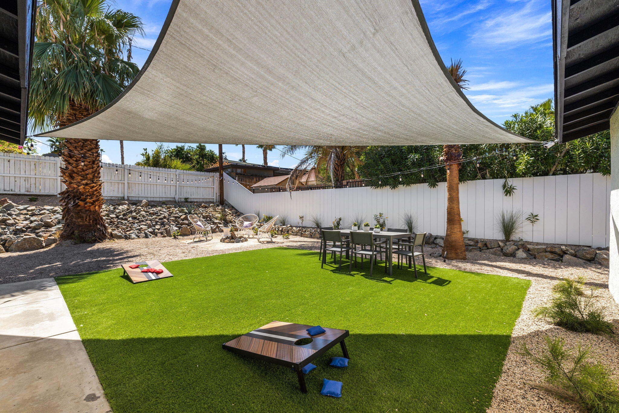 68175 Terrace Road Cathedral City, CA 92234 - Photo 13 of 53 a view of a swimming pool with lawn chairs under an umbrella