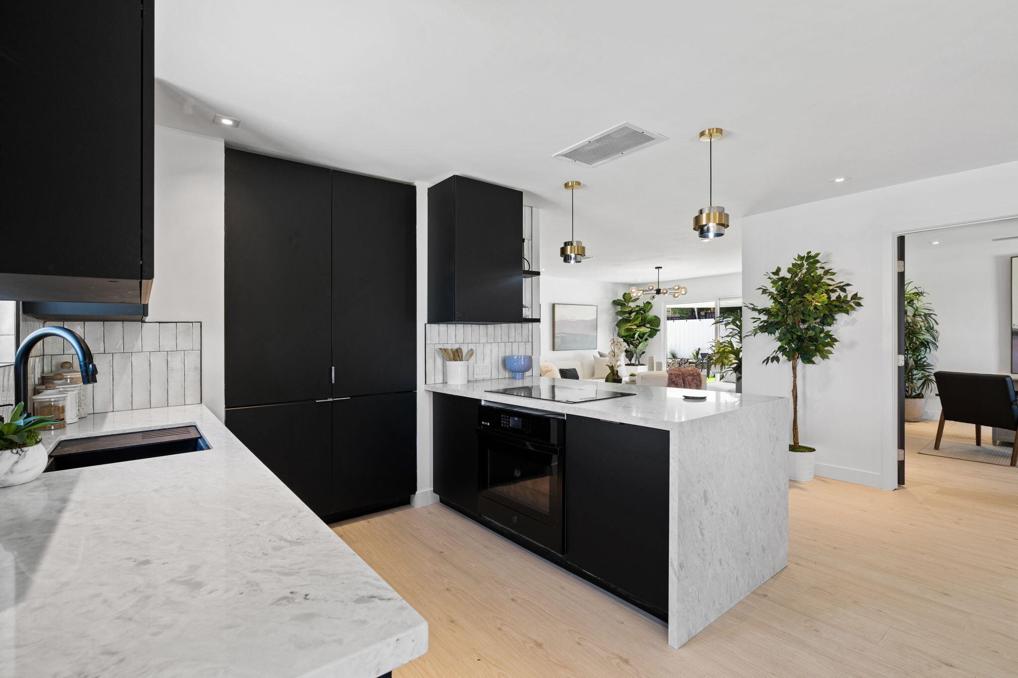 68175 Terrace Road Cathedral City, CA 92234 - Photo 19 of 53 a kitchen with stainless steel appliances kitchen island a sink and cabinets
