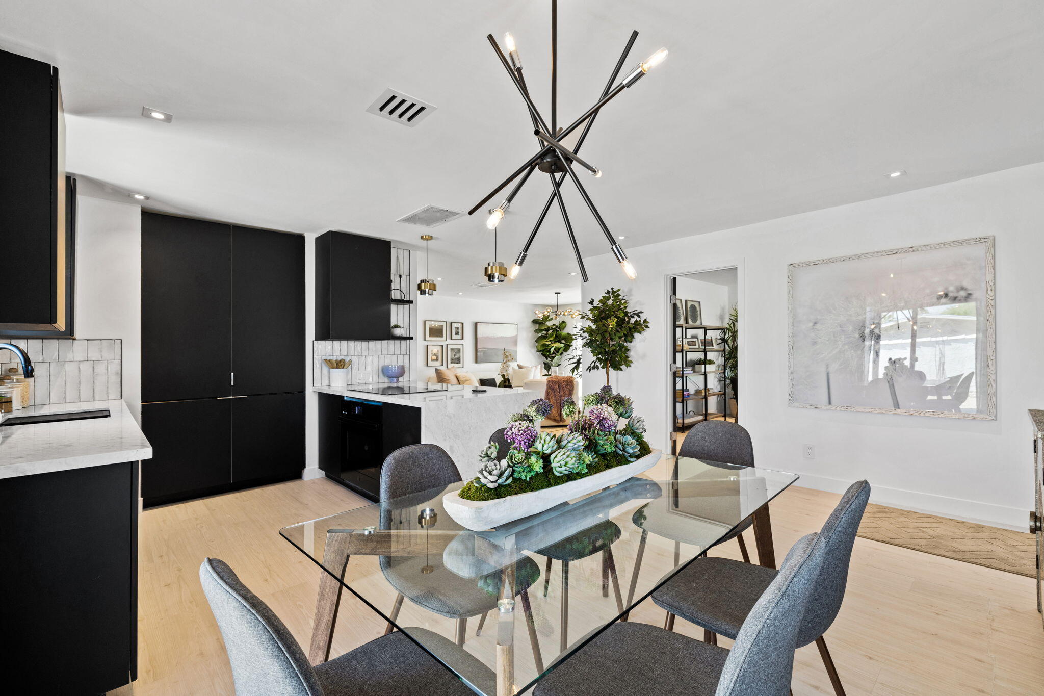 68175 Terrace Road Cathedral City, CA 92234 - Photo 22 of 53 a living room with furniture a dining table and a potted plant