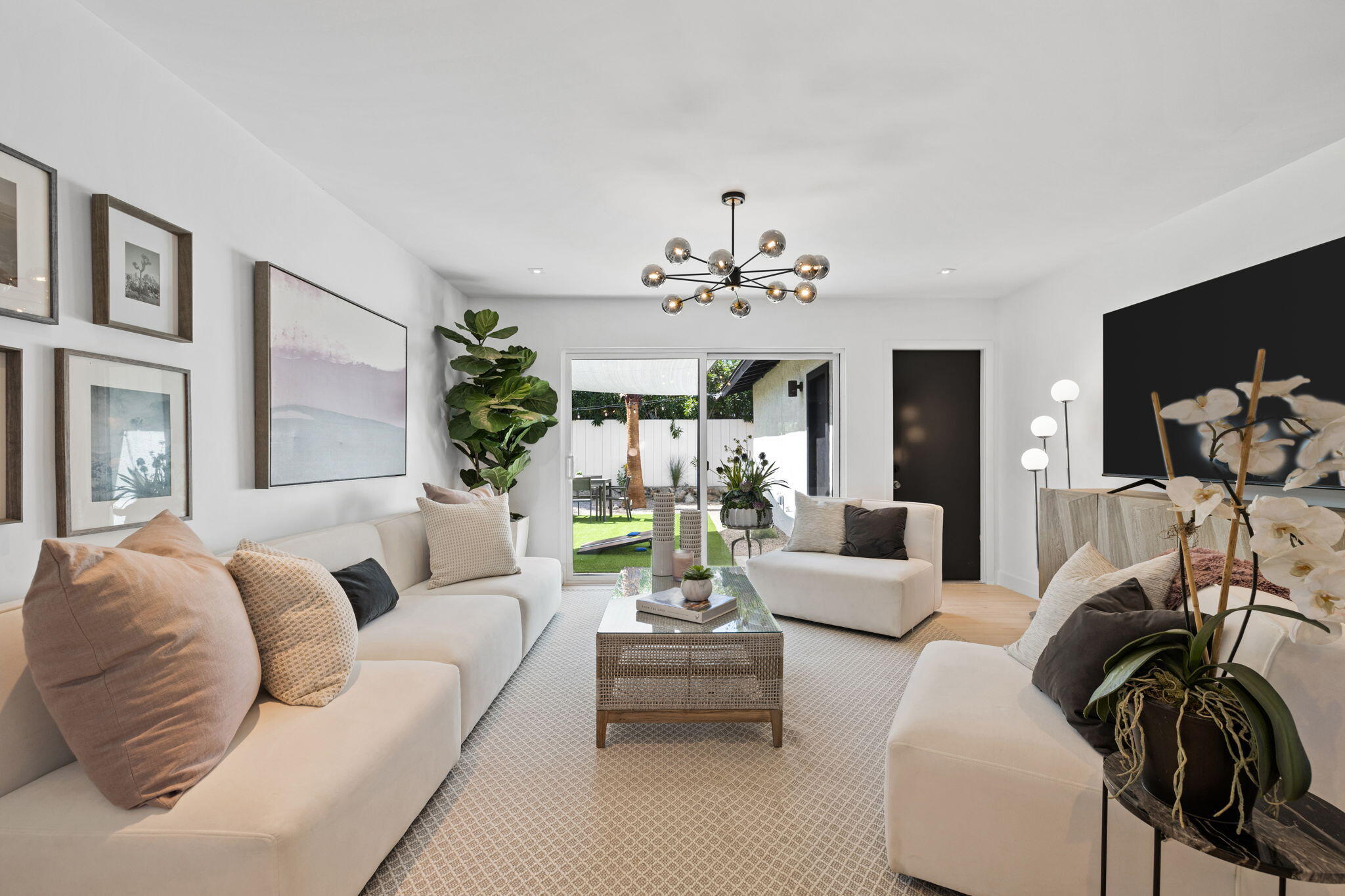 68175 Terrace Road Cathedral City, CA 92234 - Photo 33 of 53 a living room with furniture and a chandelier