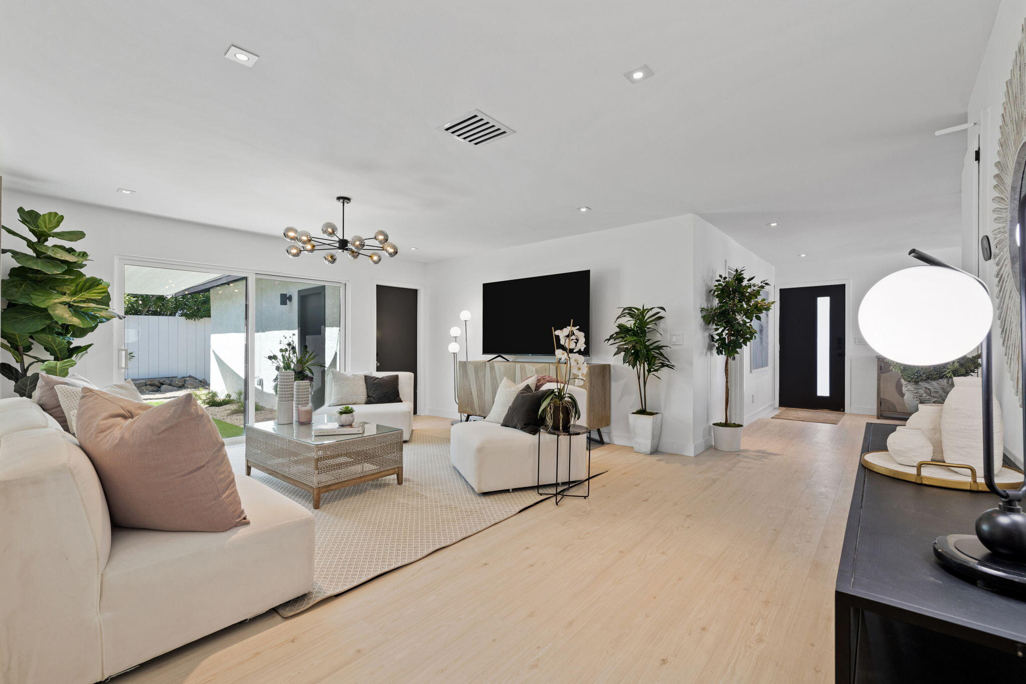 68175 Terrace Road Cathedral City, CA 92234 - Photo 38 of 53 a living room with furniture a fireplace and a flat screen tv