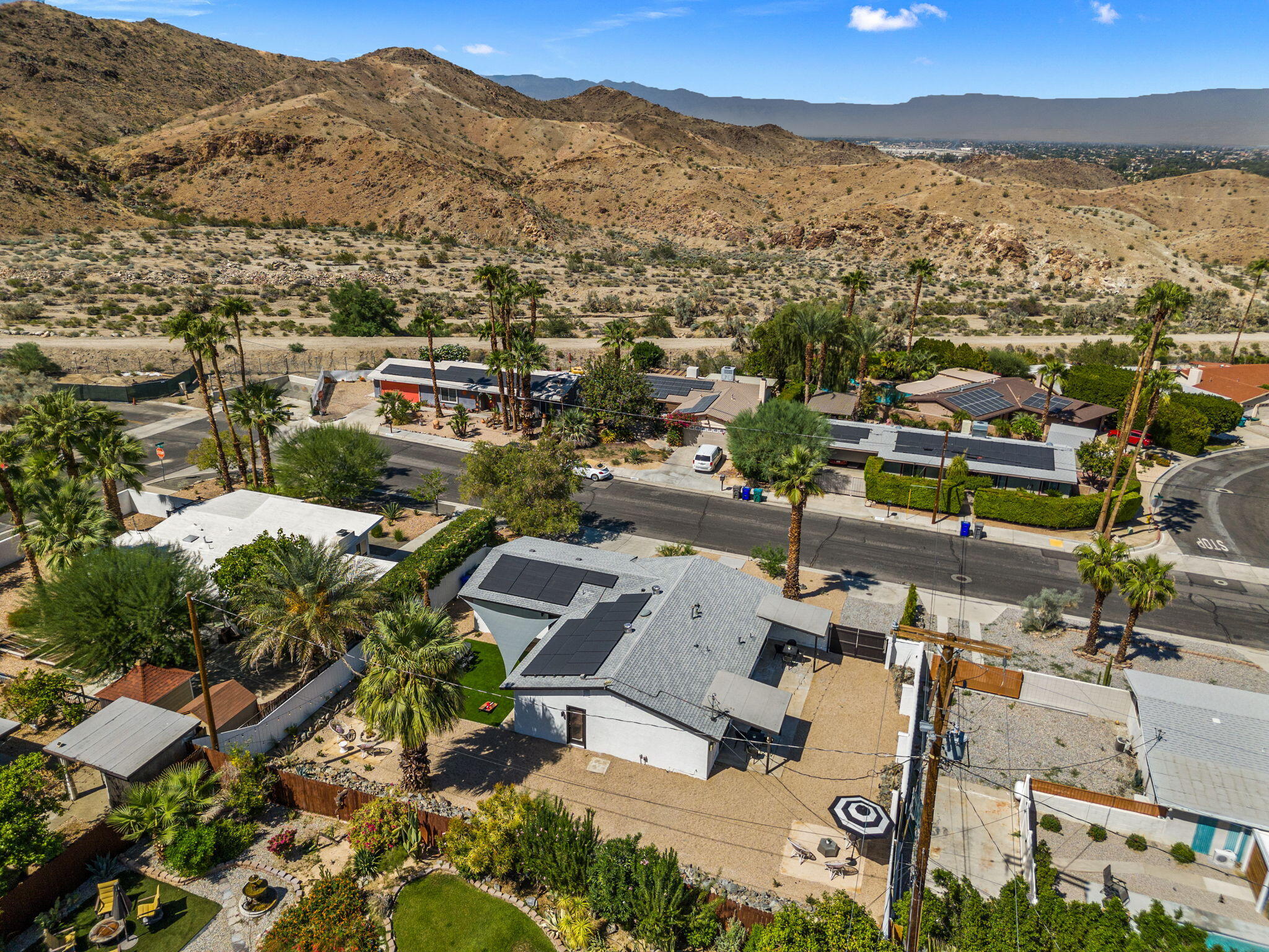 68175 Terrace Road Cathedral City, CA 92234 - Photo 50 of 53 an aerial view of a city with lots of residential buildings and mountain view in back