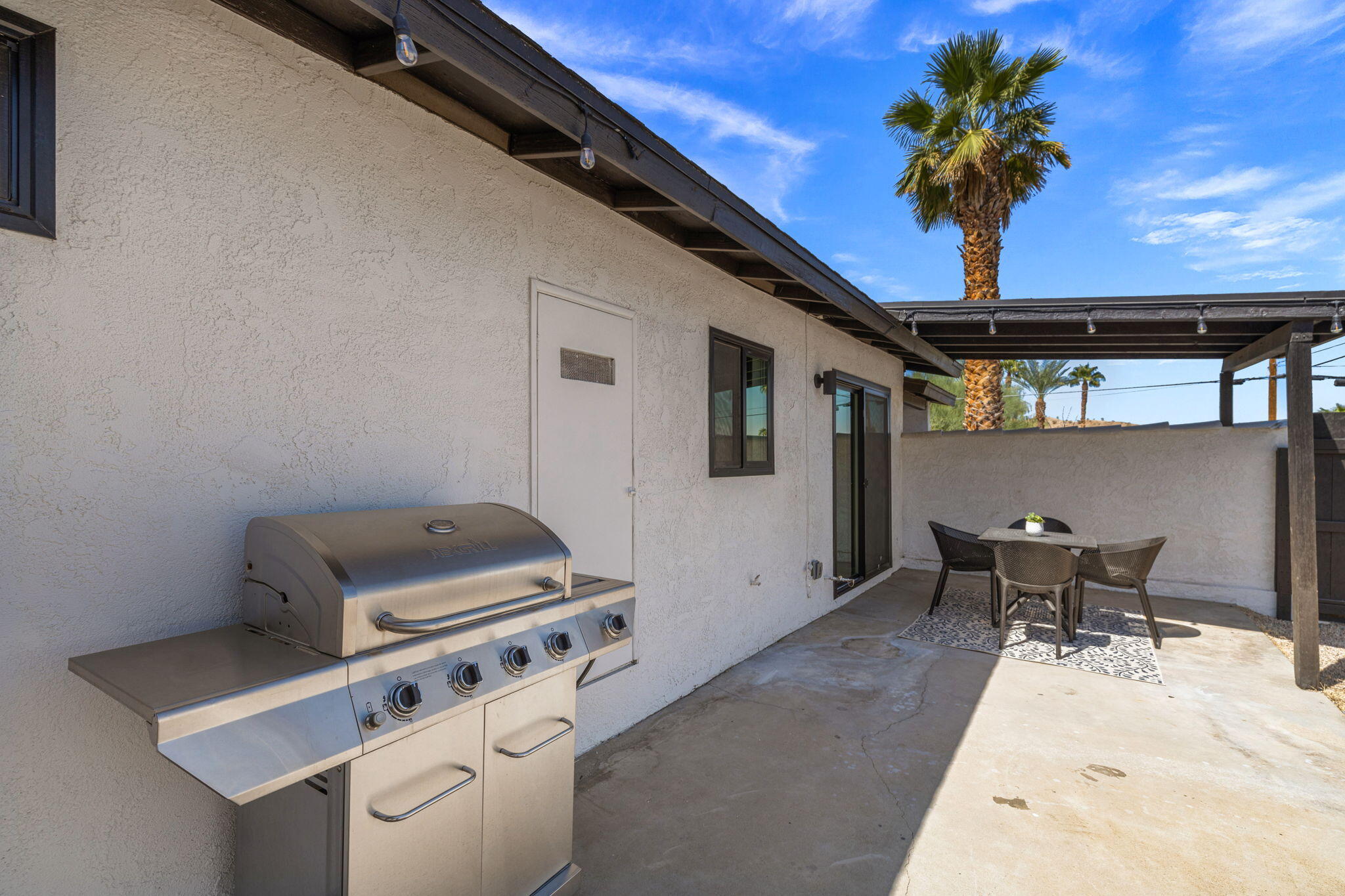 68175 Terrace Road Cathedral City, CA 92234 - Photo 51 of 53 a kitchen with a stove and a table