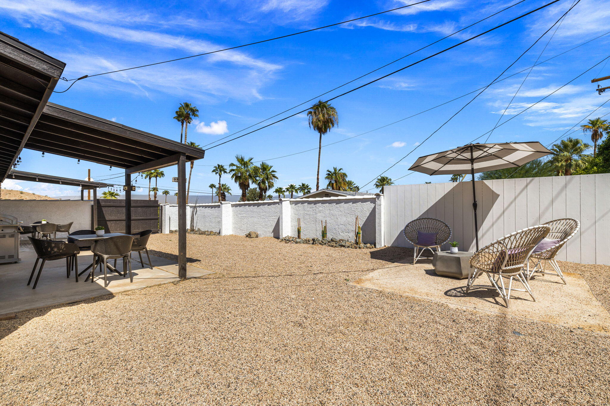 68175 Terrace Road Cathedral City, CA 92234 - Photo 7 of 53 a view of a patio with a table and chairs under an umbrella