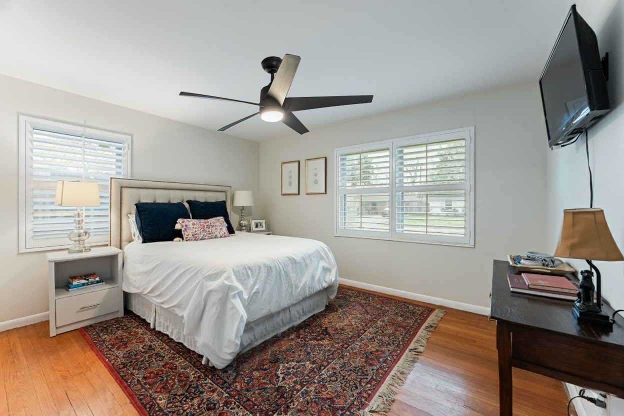 4610 Lido Lane Houston, TX 77092 - Photo 12 of 19 a bedroom with a bed and wooden floor