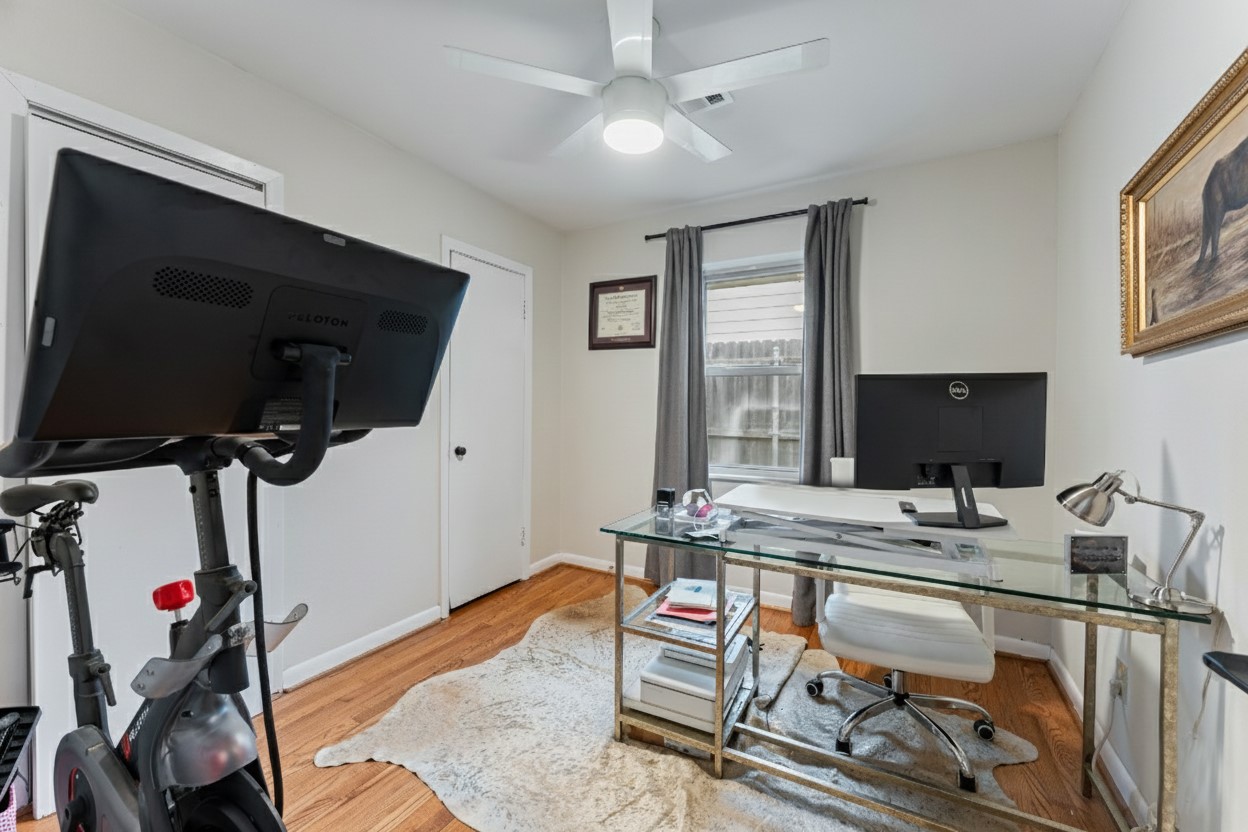 4610 Lido Lane Houston, TX 77092 - Photo 15 of 19 a work room with furniture a flat screen tv and a window