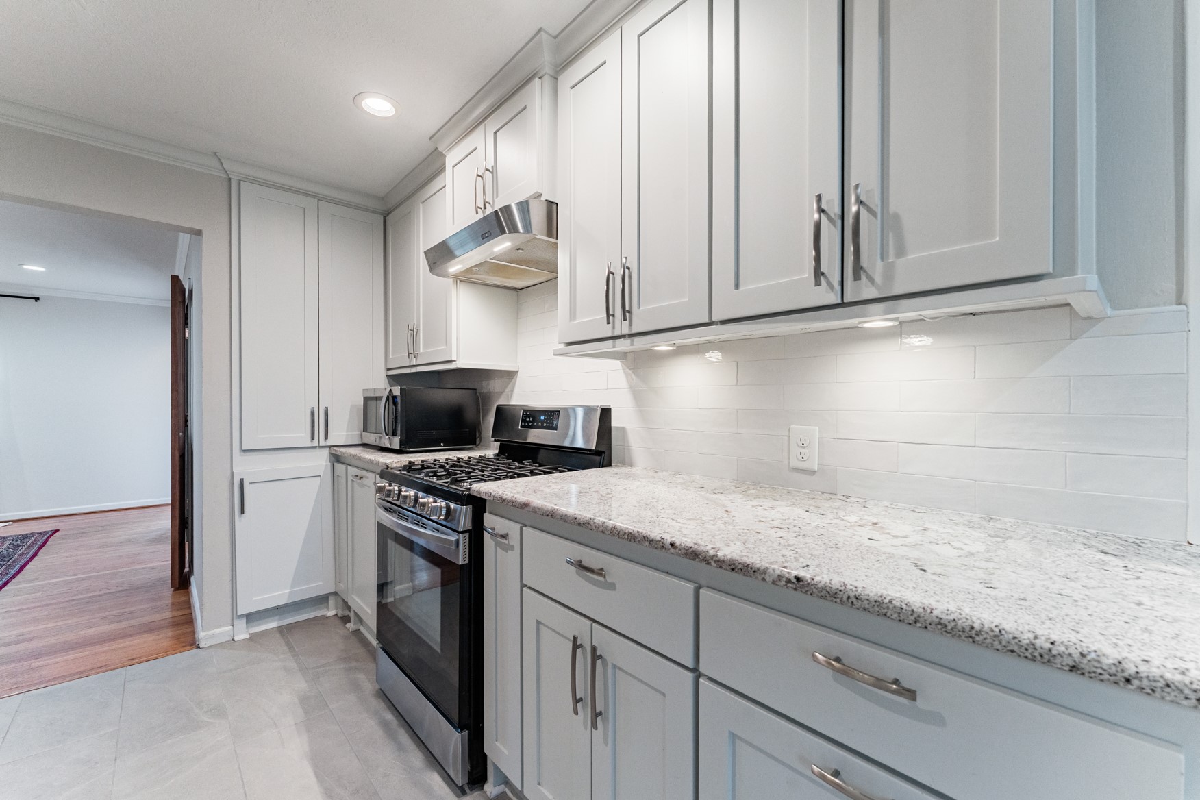4610 Lido Lane Houston, TX 77092 - Photo 7 of 19 a kitchen with granite countertop cabinets stainless steel appliances and a counter space