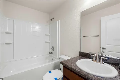 a view of storage and utility room with dryer and washer