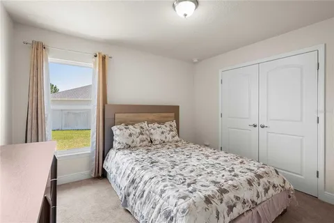 a view of a garage with rack and bicycle