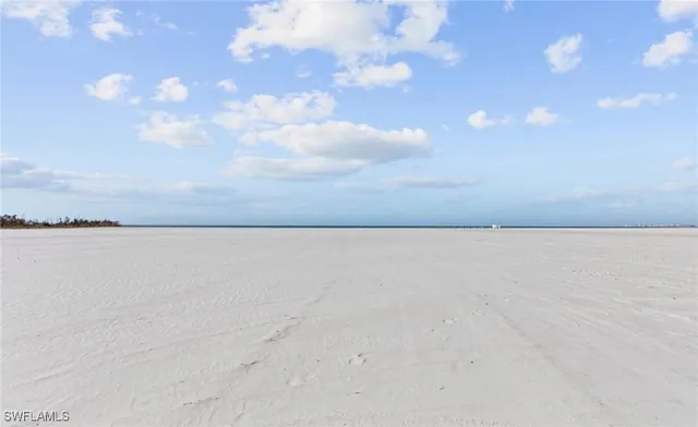 a view of a swimming pool with a lounge chair