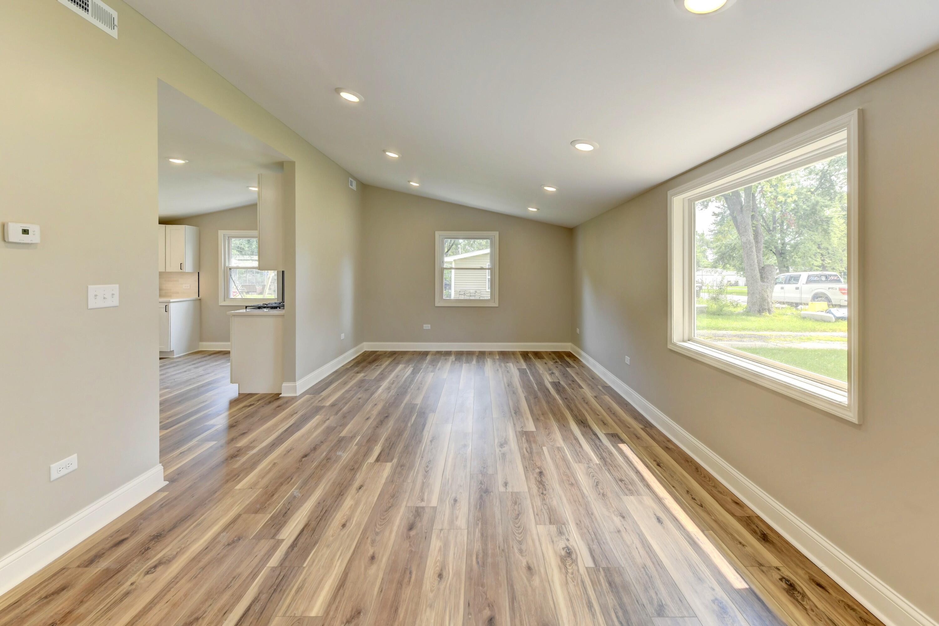 3908 West 127th Place Crown Point, IN 46307 - Photo 8 of 18 a view of a room with wooden floor and window