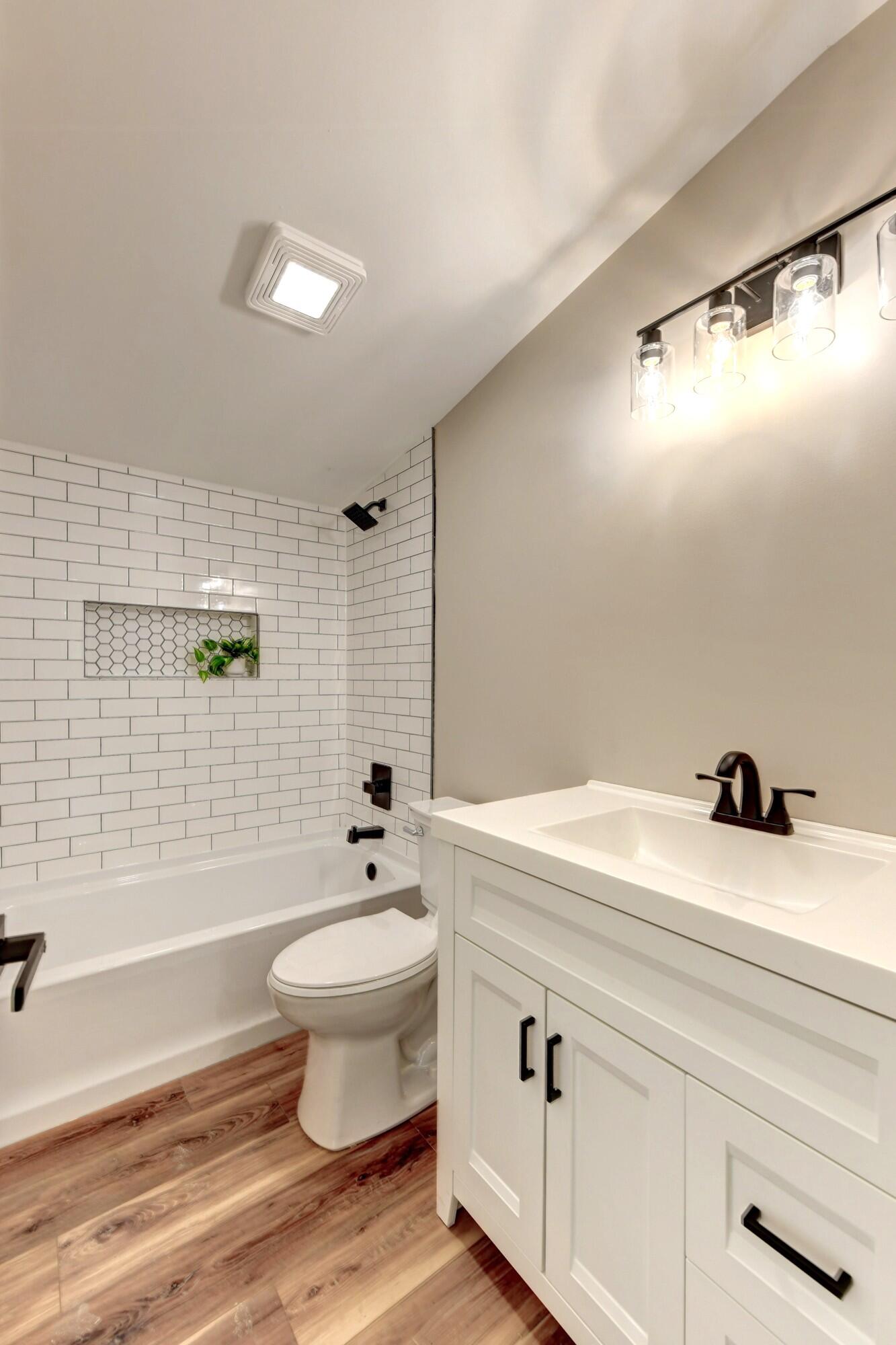 3908 West 127th Place Crown Point, IN 46307 - Photo 10 of 18 a bathroom with a sink toilet and shower